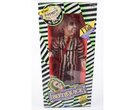 A Kenner Beetlejuice talking figure (dated 1989). Large scale doll with pull-string action. Boxed with inner packing piece, e