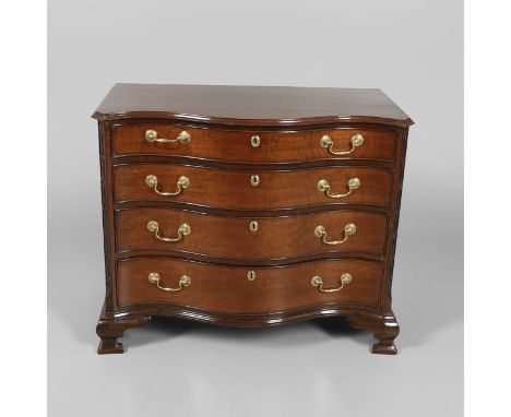 with four graduated drawers and canted corners in the Chinese Chippendale style, brass handles and ogee feet, height 80cm, wi