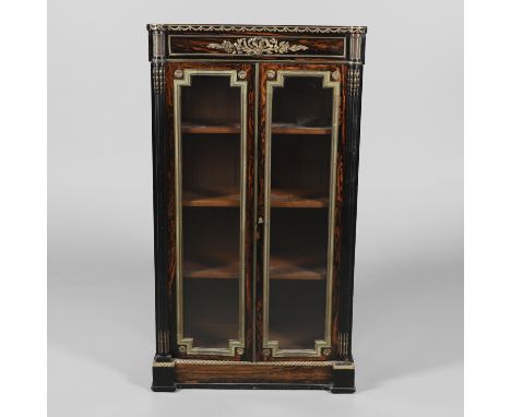 with gilt metal mounts of Classical design, the glazed doors enclosing three adjustable shelves flanked by columns, height 12