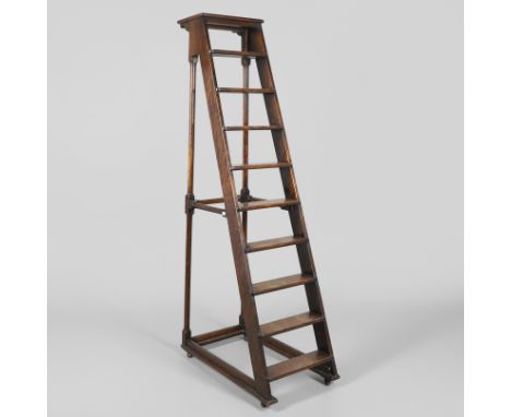 20th century, on turned and block supports raised on casters, height 194cm, width 41cm, depth approx. 90cm. *CR Light wear.