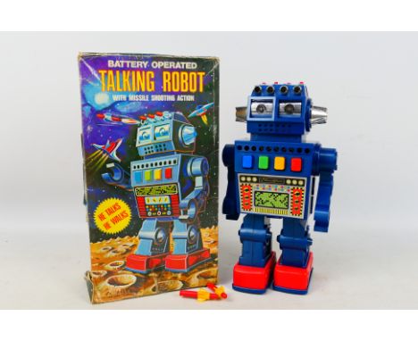 HC Toys - A boxed vintage Hong Kong made battery operated Talking Robot with missile shooting action. The Robot appears in Ex