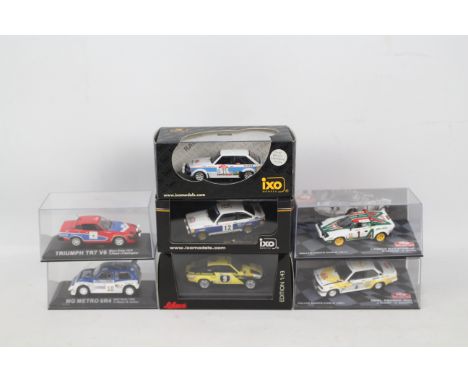 IXO - DeAgostini - Schuco - A group of seven boxed 1:43 scale diecast rally cars. Lot includes Schuco #450361200 Opel Kadett 