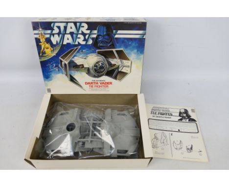  MPC - A boxed Star Wars 'Darth Vader Tie Fighter' model kit- The 1977 unbuilt model kit's parts are presented in clear, seal