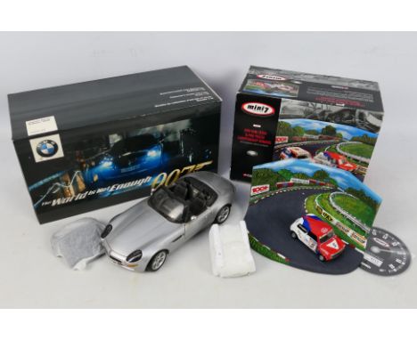 Kyosho, Corgi - A Kyosho 1:18 scale James Bond 007 'The World Is Not Enough' BMW Z8 vehicle in silver livery, appears in dust