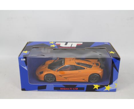 UT Models - A boxed die-cast model 1:18 scale Mclaren F1 GTR #530 151890 in orange livery - Die-cast vehicle appears in dusty
