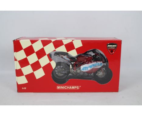 Minichamps - A boxed Minichamps #1220522291 Ducati 999F04 'Leon Haslam' Team Airwaves  BSB 2005 1:12 scale motorcycle. The mo