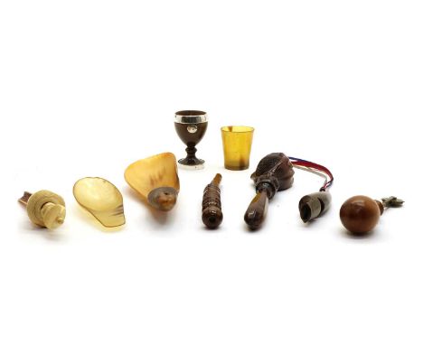 A collection of treen, a nut cracker in the form of a clenched fist, 19.5cm long, a turned wood apple corer, 15cm long, a veg
