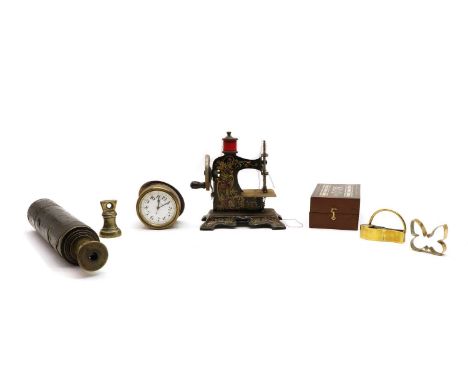 A miniature tinplate sewing machine, with printed decoration, 16cm high, a 'Stella' ships clock, enamel dial, 6cm, a mother o