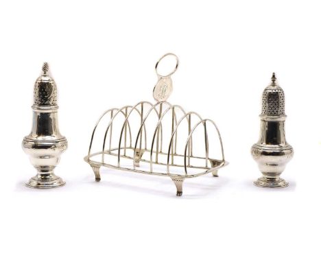 A George III silver seven-bar toast rack, by Peter & William Bateman, London 1808, of plain arched form on four fluted bracke