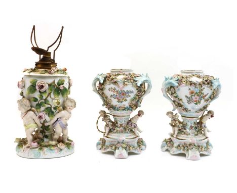 A Sitzendorf porcelain oil lamp, late 19th century, now converted to electricity, the body with a lift-out reservoir supporte