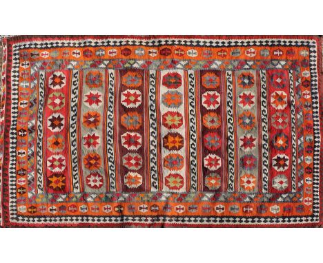 A Qashqai Kilim carpet, with a repeating geometric design, 311 x 165cmCondition report: Patches of wear and minor losses. 