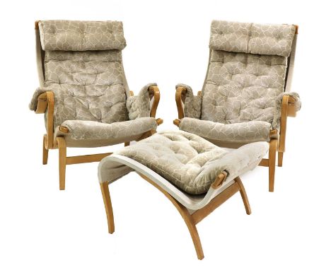 A pair of 'Pernilla 69' lounge chairs and an ottoman, designed by Bruno Mathsson for Dux, with bentwood frames, with replaced