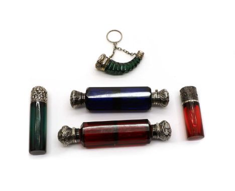 A collection of five Victorian coloured glass scent bottles, to include a double ended example in deep blue with silver mount