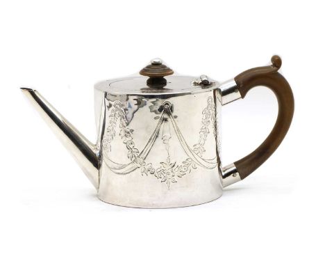 A George III silver teapot, maker's mark indistinct, London 1776, of plain drum form, the sides now engraved with entwined fl