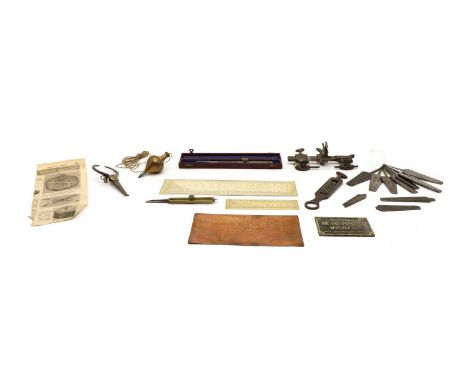 Tools, including gauges and rules, a cased steel proportional compass, 24cm long, a brass plumb bob, 10cm high, two ivory rul
