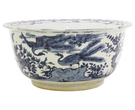 A Chinese blue and white planter, the rounded sides rising to a flared lobed rim, painted with peacocks and other birds among