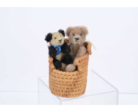 Two post- war miniature Schuco teddy bears,  the largest with light brown mohair, black pin eyes, black stitched nose and mou