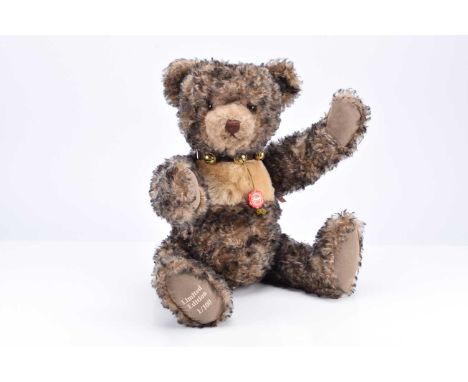 A Limited edition Hermann Theodor teddy bear,  1 of 100, with black tipped light brown mohair, leather collar with bells and 