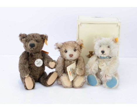Three Steiff yellow tag teddy bears,  a replica 1929 Classic Teddy Baby --9in. (23cm.) high; a replica Classic 1920 teddy bea