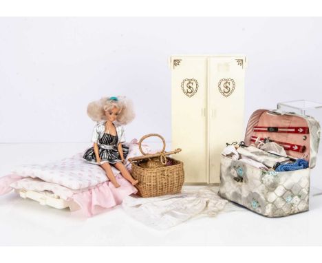 A Pedigree Sindy Wardrobe,  with coat hangers, drawers --12in. (30.5cm.) high; a Sindy bed, a small wicker basket contain acc