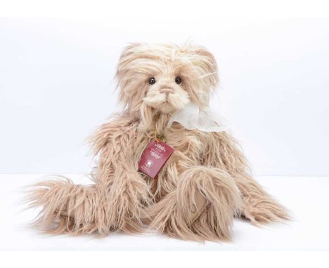 A Charlie Bears Caroline teddy bear,  designed by  Isabelle Lee, 2018, with light brown long plush and card tag --22in. (56cm