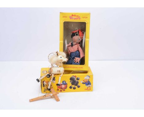 Two boxed Pelham Puppets, a foal and a junior range father puppet