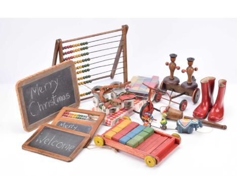 Various toys, including five tinplate spinning tops, a Riley's Toffee Christmas tin --6 1/4in. (16cm.) high, a pair of red we