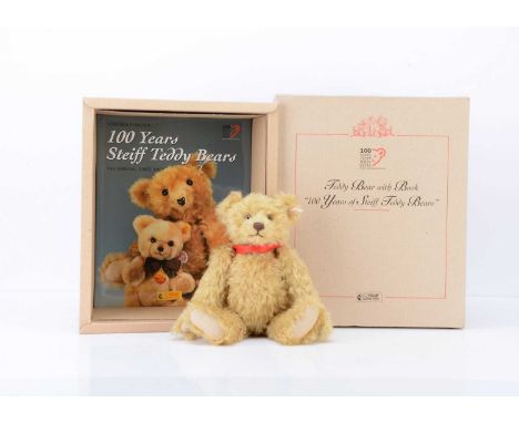 A Steiff  limited edition Teddy Bear With Book, entitled '100 years of Steiff Teddy bears', with golden mohair red silk ribbo