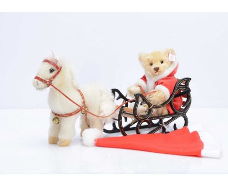A Steiff limited edition Father Christmas Teddy Bear with Pony Sledge, 1758 of 4000, blonde mohair Father Christmas bear with