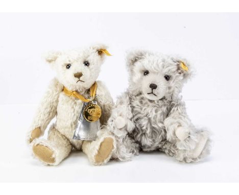 Two Steiff yellow tag teddy bears, a Danbury Mint Millennium bear with medallion --12 1/2in. (32cm.) high; and another