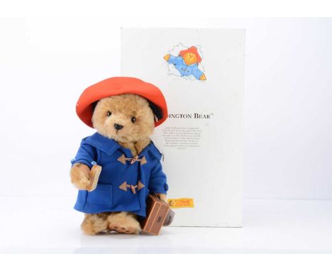 A Steiff limited edition Paddington Bear,  3045 of 5000, with brown mohair, holding a marmalade sandwich and suitcase, in ori