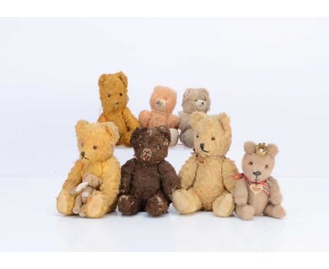 Seven small German post-war pin-jointed teddy bears,  including a light brown mohair bear with orange and black glass eyes, b