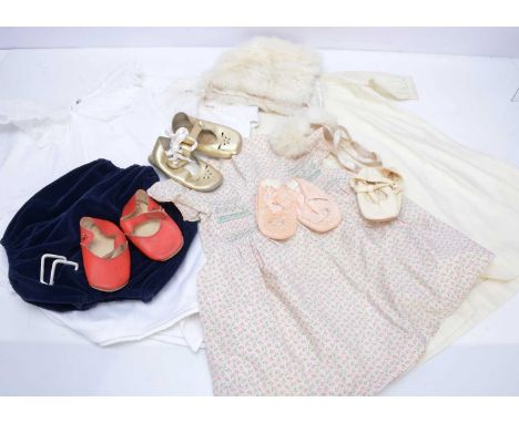 A quantity of vintage children's clothes,  nine dresses or rompers, a white fur hat with two pom-pom ties, night clothes and 