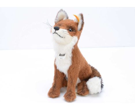 A Steiff yellow tag Ferdy Fox soft toy, with red brown alpaca fur, in a seated position --11in. (28cm.) high to top of ears