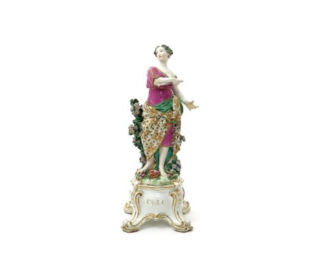 A Chlesea Gold Anchor figure of one of the Nine Muses, c.1760-65, probably Euterpe, holding a pipe in her right hand and wear