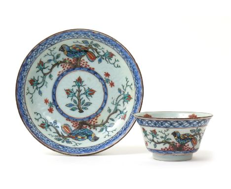 A Chinese porcelain Dutch-decorated teabowl and saucer, c.1720-25, originally decorated with horizontal bands of cash diaper 