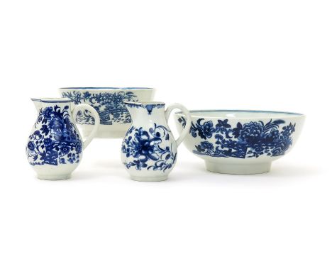 Two Worcester blue and white milk jugs and a slop bowl, c.1770-80, one jug and the bowl printed with the Fence pattern, the o