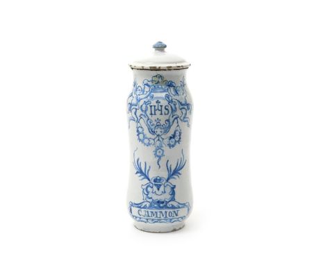 A Spanish faïence albarello and cover, dated 1773, probably Talavera, painted in blue with a monastic emblem of two putti sup