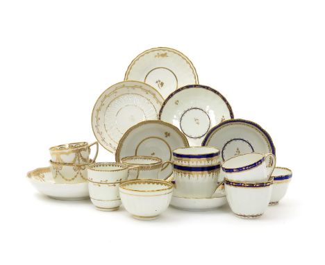 Two Derby trios, c.1800, three teabowls and saucers and two coffee cups and saucers, variously decorated in gilt, the trios a