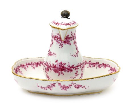 A Sèvres jug and basin, c.1760-70, painted in puce monochrome with flowers garlanded around two horizontal rails within a gil