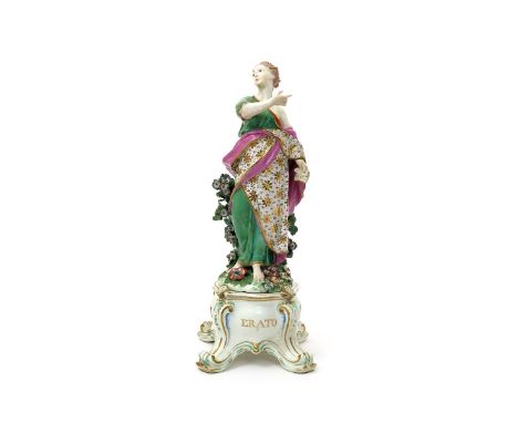 A Chelsea Gold Anchor figure of one of the Nine Muses, c.1760-65, probably Thalia, holding a scroll in her left hand, her rig