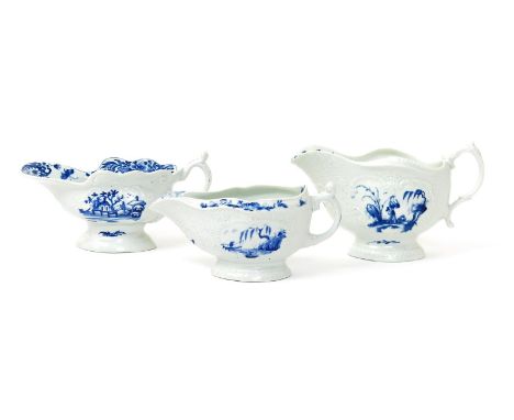 Three Worcester blue and white sauceboats, c.1755-65, one painted with the Triangular Platform pattern, one with the Man with