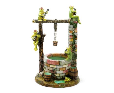 A large Jérôme Massier Majolica model of a wishing well, late 19th/early 20th century, unusually modelled with four musical f