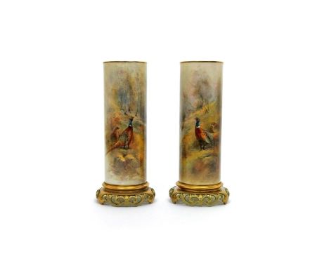 A large pair of Royal Worcester cylindrical vases, date codes for 1924, of shape 6/161, painted by James Stinton, each with a
