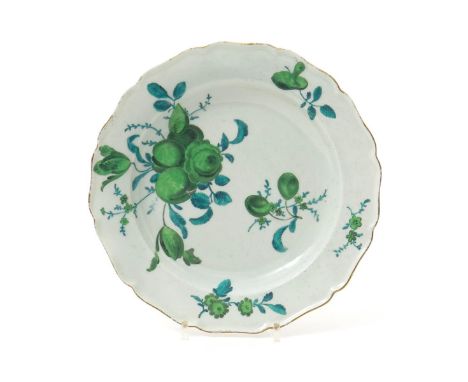 A Worcester plate, c.1770, painted in the London atelier of James Giles, in green camaieu with sprays of fruit and flowers, a