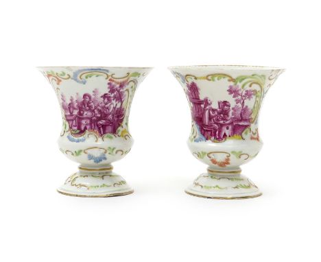 A pair of Frankenthal vases, dated 1772, of campana shape, painted in puce monochrome to one side with figures drinking and p