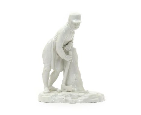 A Höchst white-glazed figure of a woodcutter, c.1775, modelled by Johann Peter Melchior, standing and leaning on the stump of
