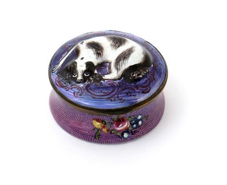 An enamel snuff box, c.1770, moulded with a recumbent black and white spaniel on a circular purple cushion, the sides of the 