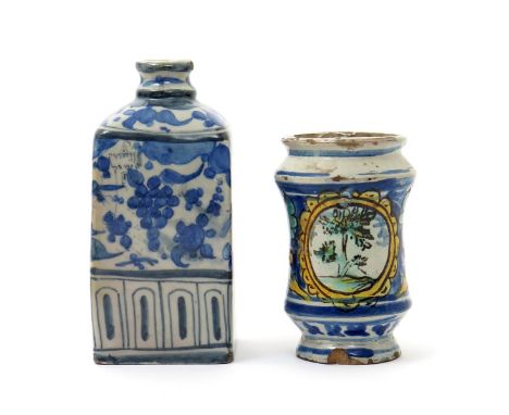 A miniature Sicilian maiolica albarello, late 17th century, the waisted form painted with a tree in a panel reserved on a gro