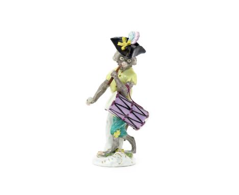 A Meissen monkey band figure, mid 18th century, modelled by Peter Reinicke, playing a fife and a tall drum slung over one arm